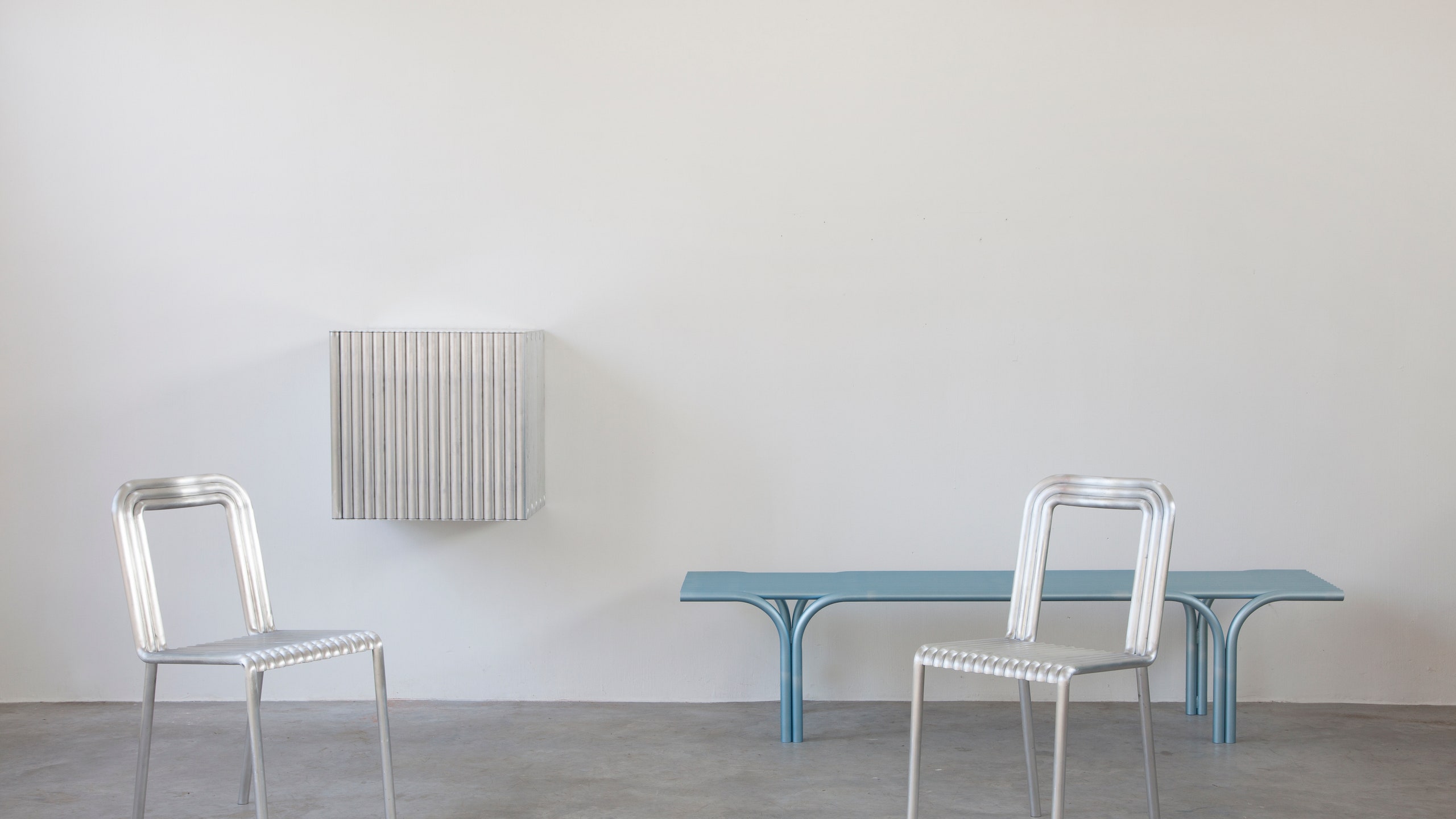 Коллекция мебели из алюминиевых труб от Muller Van Severen