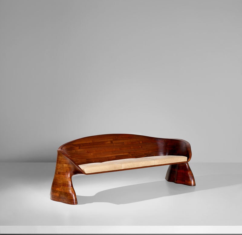 WENDELL CASTLE 19322018 Unique threeseater sofa 1974 Stacklaminated walnut leather. 70.5 x 210 x 80 cm  Side incised...