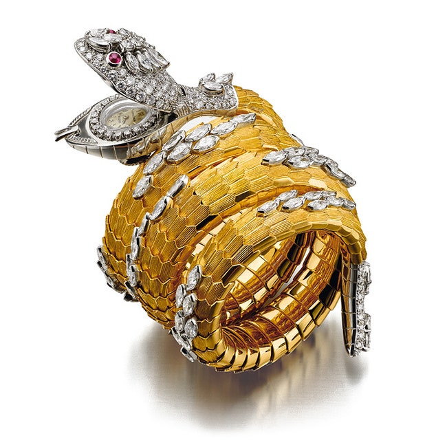 Браслет с часамисекретом Serpenti из золота рубинов и бриллиантов 1968 год.