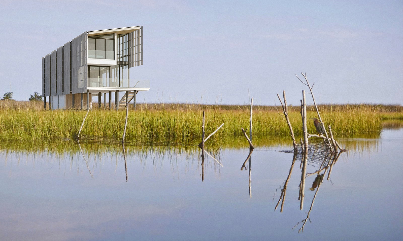 A modern waterfront house sited directly on the edge of the Barnegat Bay.